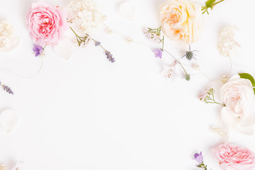 Festive flower composition on the white wooden background. Overhead view