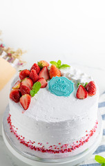 Home made cake with strawberries and cream