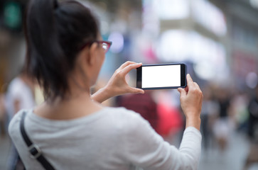 Woman use smartphone at city