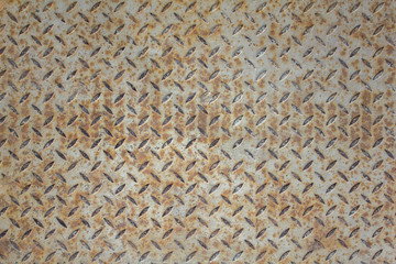 white gray metal sheet with a diagonal pattern and brown rust. rough surface texture