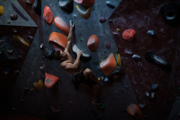 Athletic man practicing in a bouldering gym © Nejron Photo