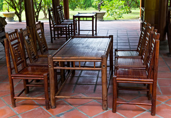 Cafe restaurant resort terrace with wooden chairs and table