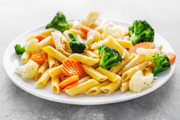 Healthy pasta penne with vegetables on plate