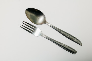 spoon and fork isolated in white