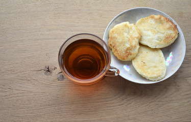 A mug of drink and food on a plate.