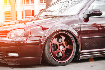 Custom brown forged wheels on a low tuned stance car who stays on a street. dirty Lowrider on a air...