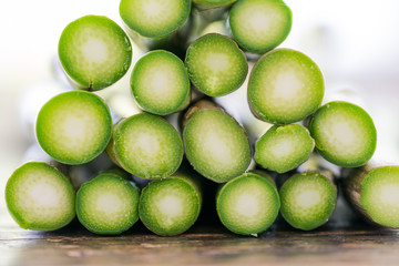 close up macro view of stacked fresh organic green asparagus