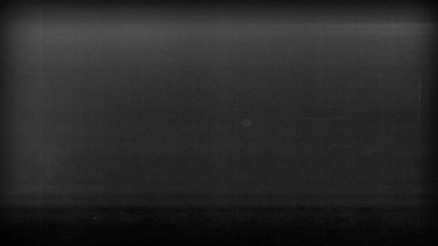 Old Film Photocopy Textured Background Loop/ 4k animation of a vintage old film movie with black and white grunge noise and grainy texture background seamless looping