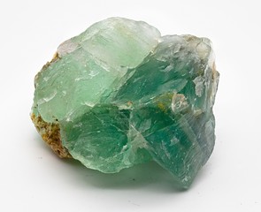 Green translucent fluorite mineral crystal stone isolated on white limbo background