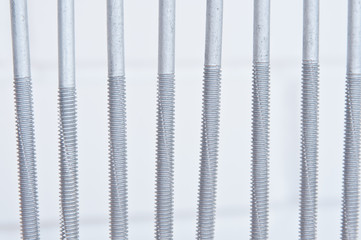 Screws macro photo. Metal screws are used to fasten insulation panels to the metal frame of a new building.