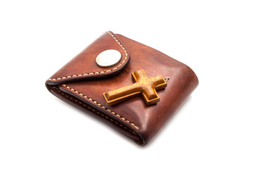 wallet and cross on white background 