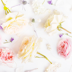 Festive flower composition on the white wooden background. Overhead view