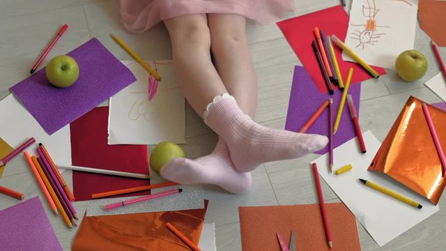 little girl draws with pencils, children's creativity, development