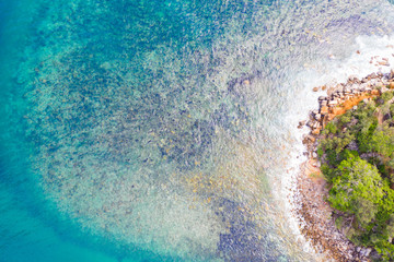 Blue waters rocky cove aerial in Sydney