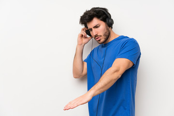 Handsome man listening to music with headphones