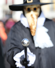 Plague doctor costume in Venice intentionally blurred the backgr