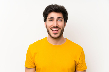 Handsome over isolated white wall with surprise facial expression