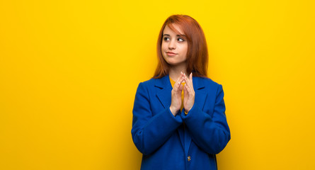 Young redhead woman with trench coat scheming something