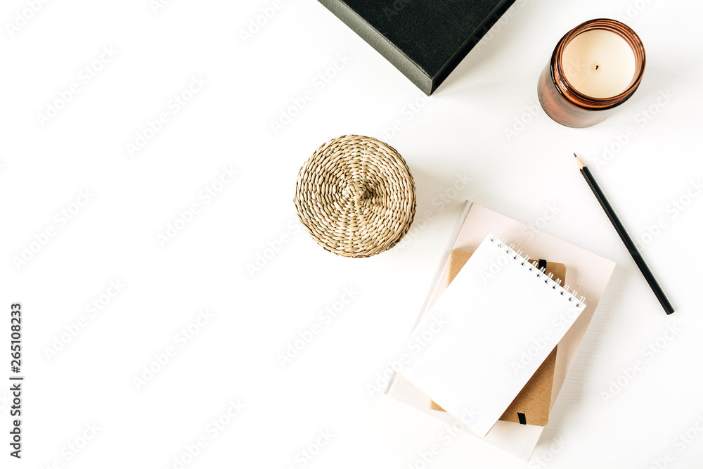 Wall mural neutral minimal office desk workspace with notebook on white background. flat lay, top view.