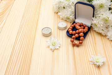 Romantic gift concept. Valentines day or 8th march or love holiday. Present case and flowers. Table setting on wooden background