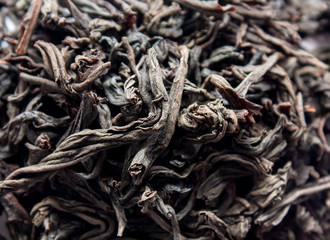 Leaves of black dry tea close-up. View from above