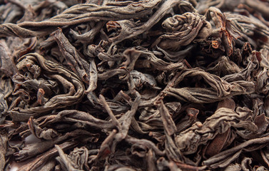 Leaves of black dry tea close-up. View from above