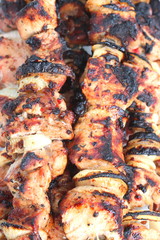 Barbecue skewers with juicy appetizing delicious meat closeup