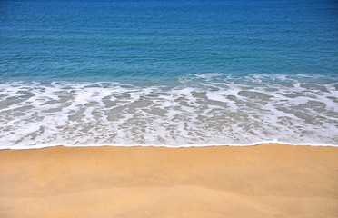 Deep blue water of sea and sand beach