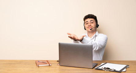 Telemarketer man holding copyspace imaginary on the palm to insert an ad
