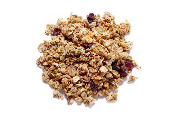 Crunchy granola or muesli scattered, isolated on white, top view.