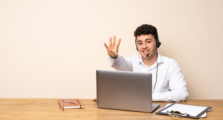 Telemarketer man happy and counting four with fingers