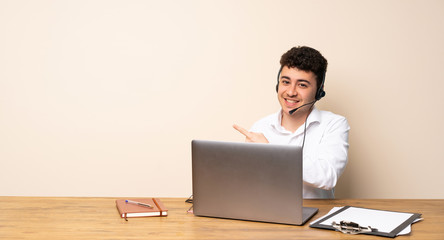 Telemarketer man pointing to the side to present a product