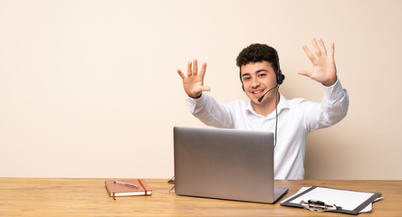 Telemarketer man counting ten with fingers