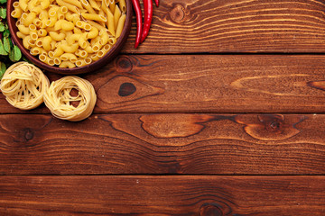 dried pasta on wooden background