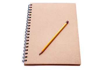 Sketchbook with pencil isolated on white background