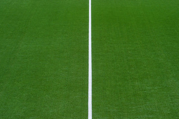 Obraz premium Artificial green turf texture background with white line marks