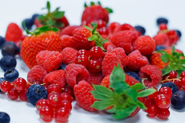 assorted fresh berries with white background