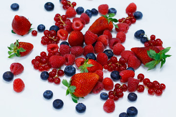 assorted fresh berries with white background