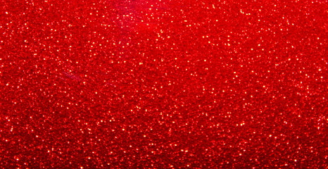Sparkling red glitter background close up