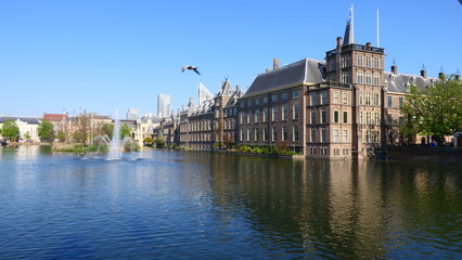 Fototapeta na wymiar View to the historical Binnenhof with the Hofvijver lake by day in The Hague, Netherland