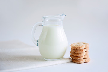 Milk and cookies on the white background
