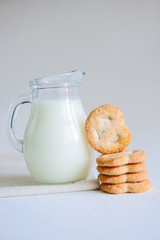 Milk and cookies on the white background
