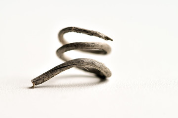 Abstract photographs of a dried mustache of a vine (curled vine tendrils) can be interpreted as...