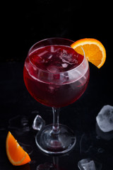 Fresh red colorful alcoholic cocktail Sangria with lemon and ice