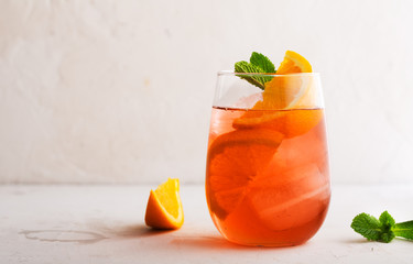 Fresh ice berry summer cocktail with orange and ice