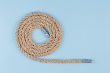 rope on a blue background, a katana twisted on a table