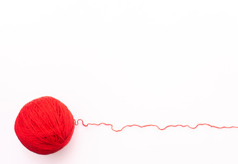 Red yarn on a white background