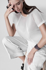 Sensual model in white modern clothes