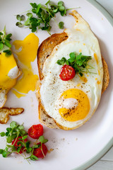Breakfast with toast and fried eggs