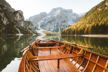 Traditional rowing boat on a lake in the Alps in fall